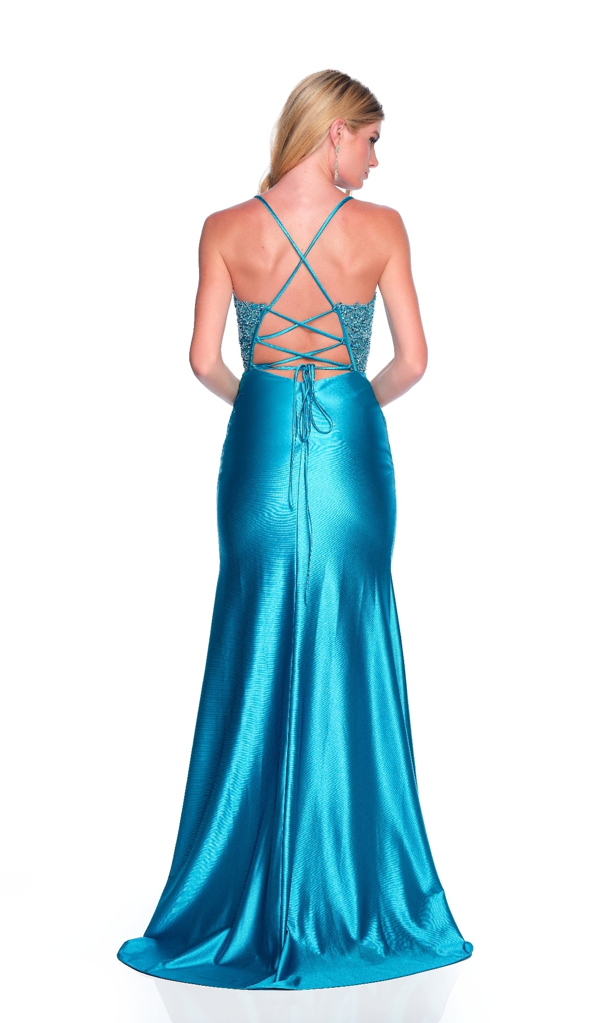 A woman models the Dave & Johnny 11996 long turquoise prom dress, featuring a shiny finish, corset bodice, lace-up open back, and thin crisscross straps, as she stands facing away against a white background.